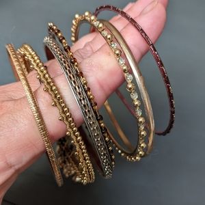 Mix of 7 Costume jewelry bangle bracelets bronze color